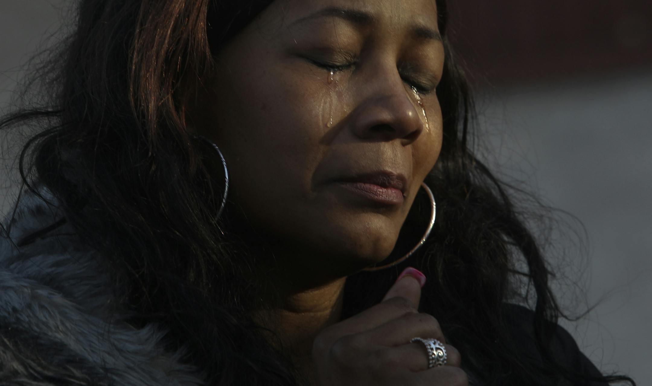 Erica Whitaker, the mother of shooting victim Erick Felton, shed tears during the vigil at 39th and Fremont Ave. N. for Felton and and Demetrius Harper, 32, Thursday, March 14, 2013. The vigil was held outside 3859 Fremont Ave. N, where the men had been killed at at illegally operating club.] (DAVID JOLES/STARTRIBUNE) djoles@startribune.com A vigil is scheduled Thursday for the victims of last week's shooting at the illegal club on 39th and Fremont in north Minneapolis. Killed in the shooting we