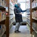 Kathy Defor looked through books after hours at Elko New Market Library.