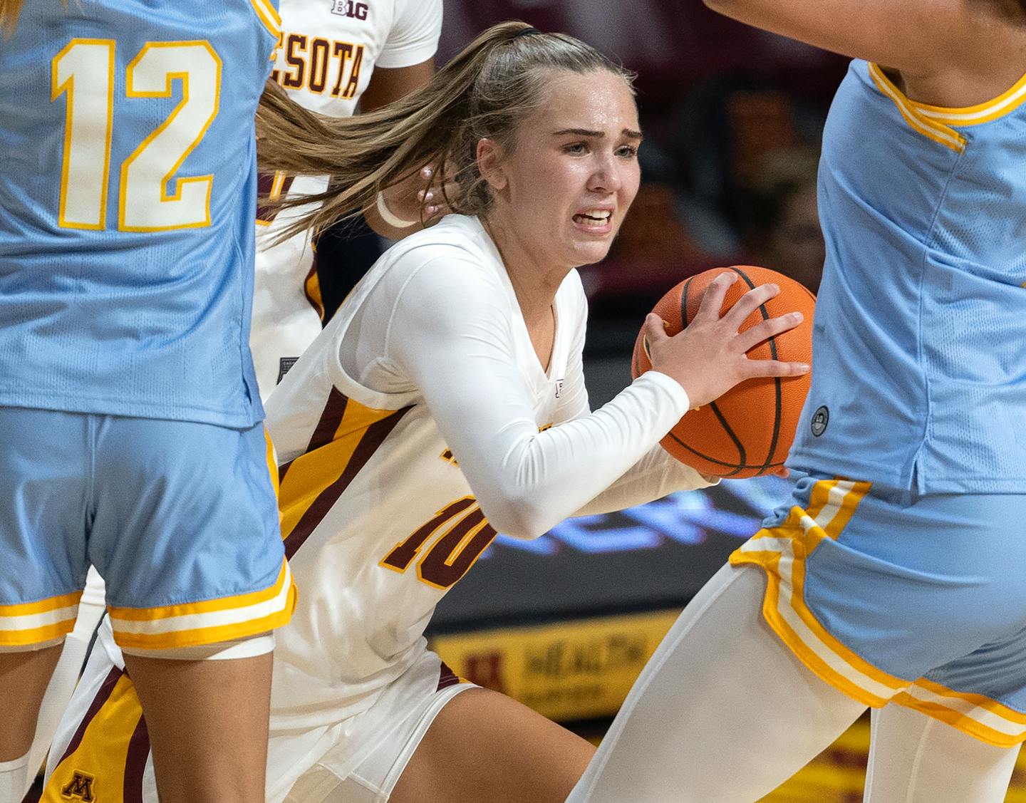 Mara Braun (10) of Minnesota looks for space between two Long Island defender in the third quarter Wednesday, November 8, 2023, at Williams Arena in Minneapolis, Minn. ] CARLOS GONZALEZ • carlos.gonzalez@startribune.com