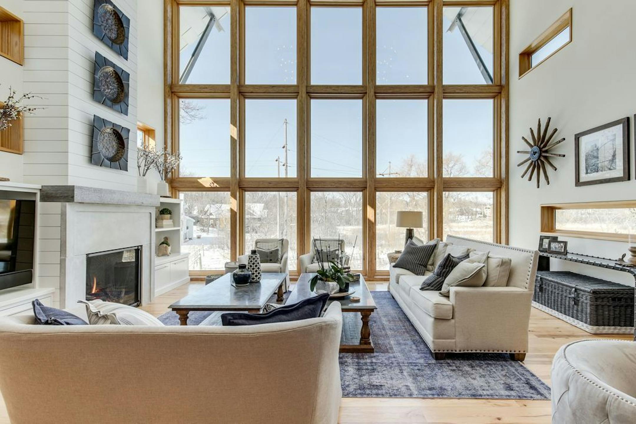 A seating area in the living room, in front of the fireplace.