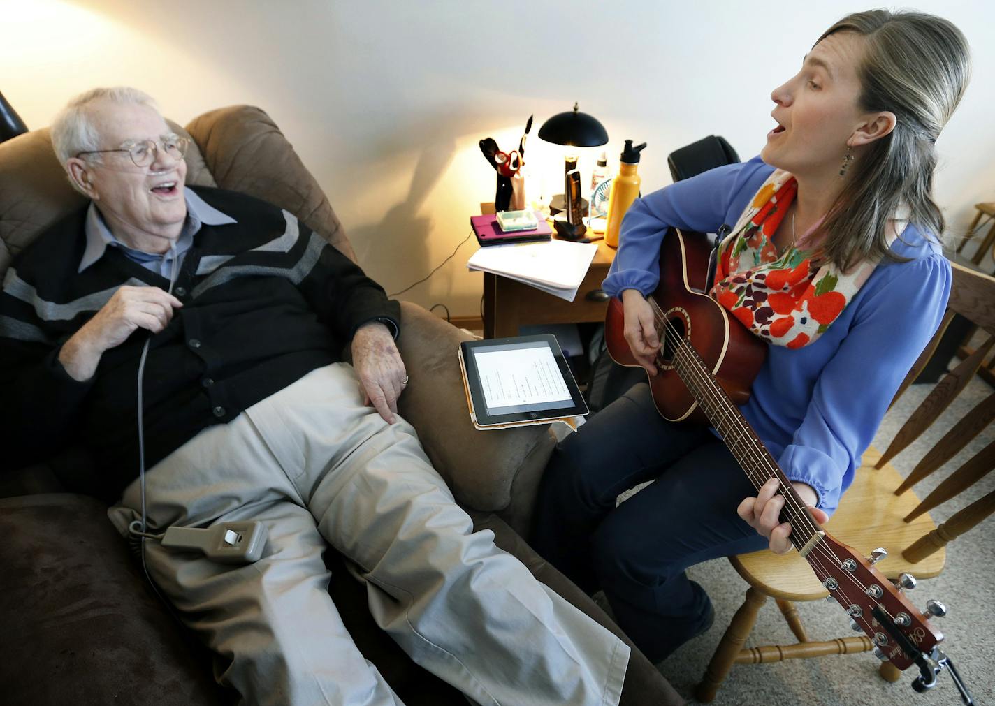 Hospice music therapist Sarah Newberry sang to Harry Oxley at Epiphany Senior Housing in Coon Rapids. ] CARLOS GONZALEZ cgonzalez@startribune.com - January 22, 2013, Coon Rapids, Minn., hospice music therapists, They do their work in hospices, and befitting that locale, they aim not to cure dying patients but to soothe and sustain dying patients. But their form of health care is music, of all genres.