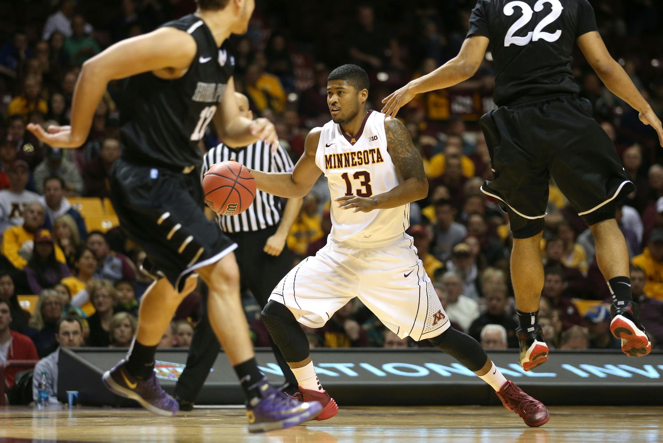 Maverick Ahanmisi avoided High Point's Adam Weary on his way to the basket in the second half.