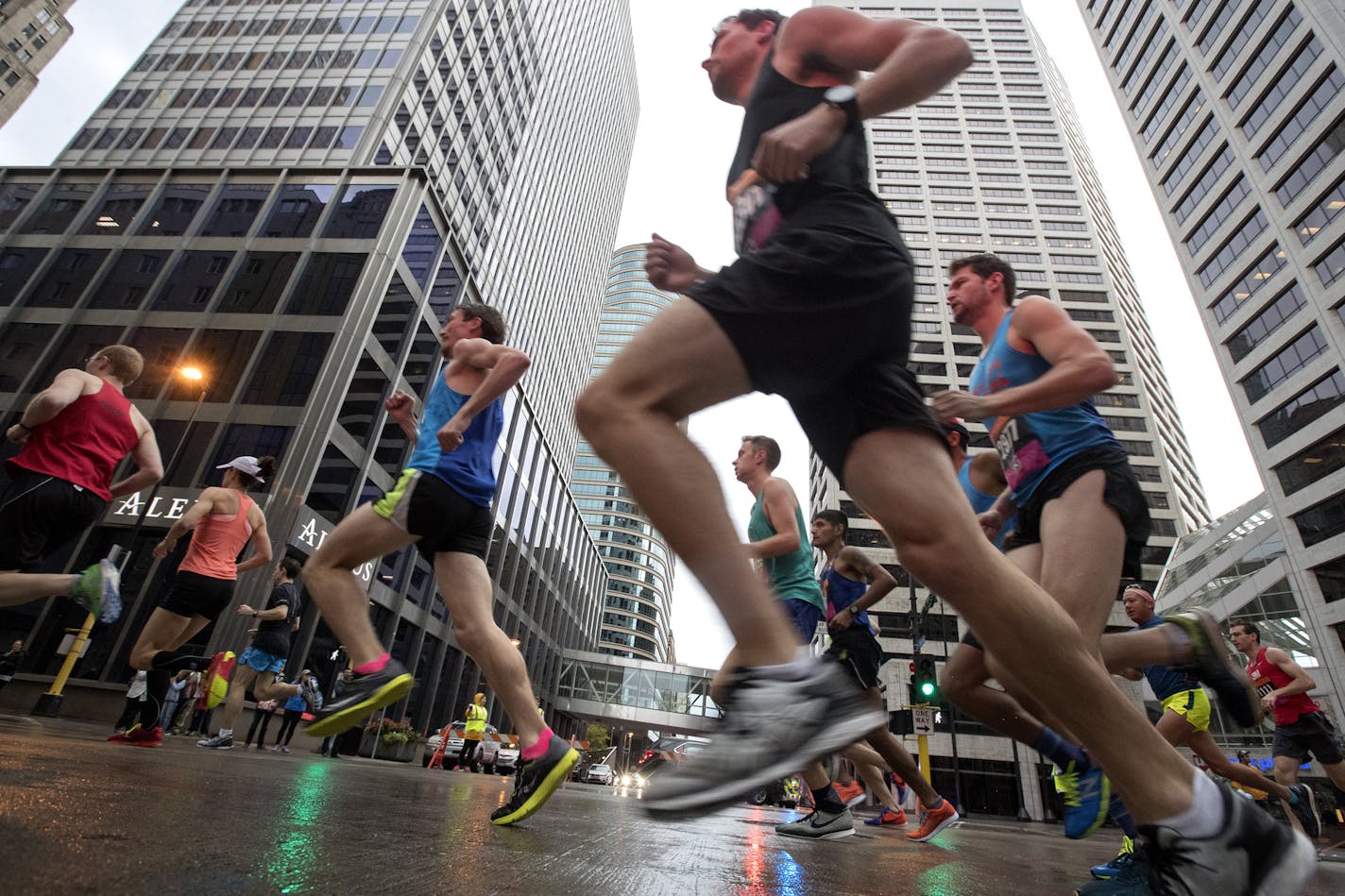 Runners make their way though downtown Minneapolis at the the start of the Twin Cities Marathon in 2017.