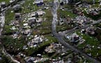 Destroyed communities are seen in the aftermath of Hurricane Maria in Toa Alta, Puerto Rico on Thursday, Sept. 28, 2017. The aftermath of the powerful