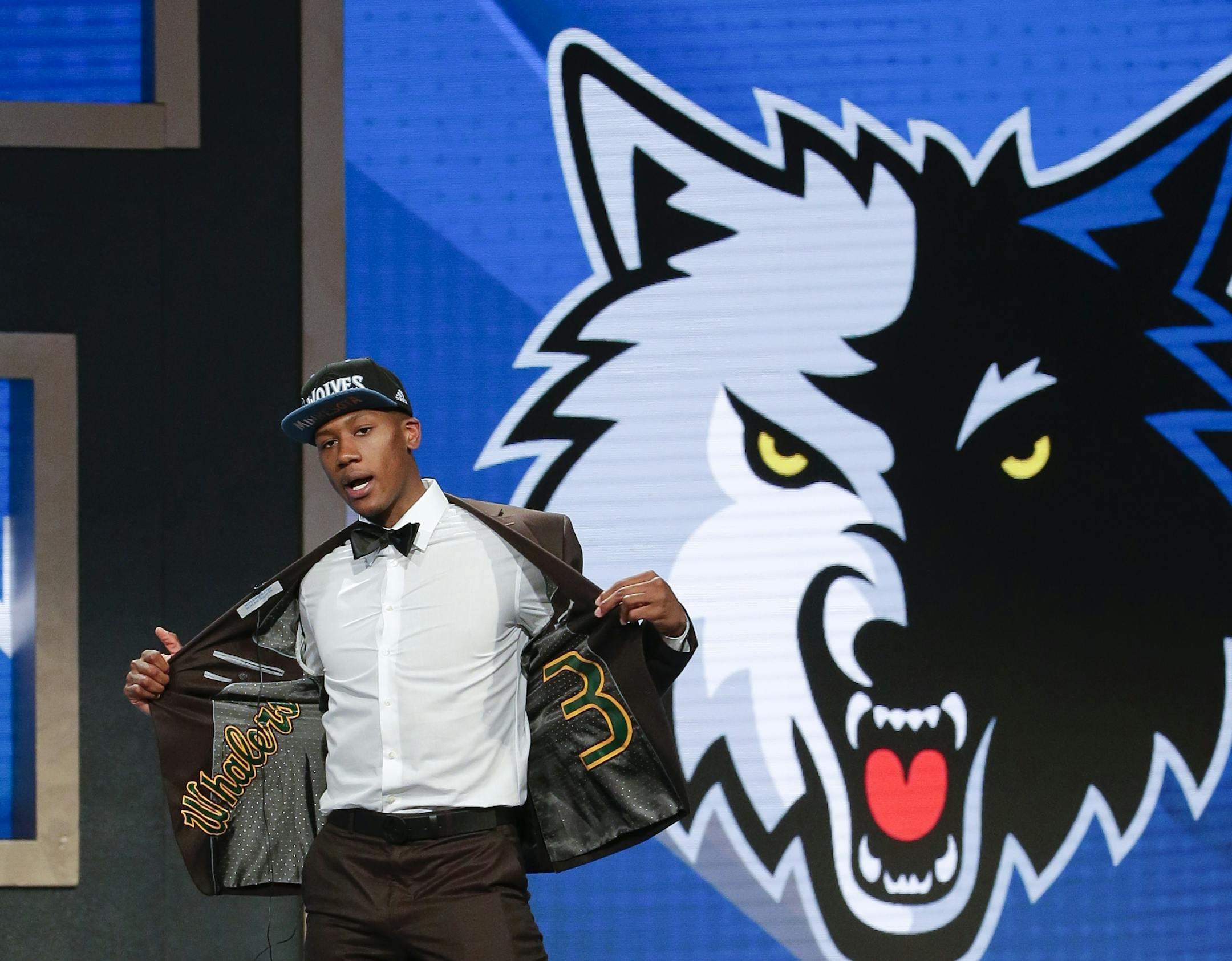 Kris Dunn reacts as he steps up on stage after being selected fifth overall by the Minnesota Timberwolves during the NBA basketball draft, Thursday, June 23, 2016, in New York.
