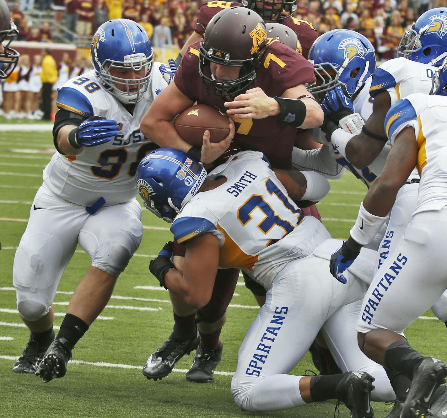 Minnesota Gophers vs. Western Illinois Leathernecks football. Mitch Leidner dragged San Jose State tacklers with him as he picked up a first down in 2nd half action. (MARLIN LEVISON/STARTRIBUNE(mlevison@startribune.com)