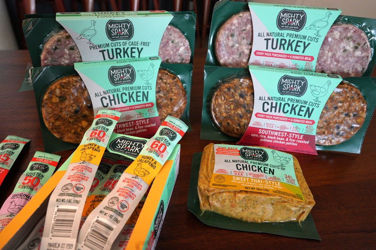 Products from Mighty Spark Foods, a Minneapolis maker of lean natural meats, links and blended patties.