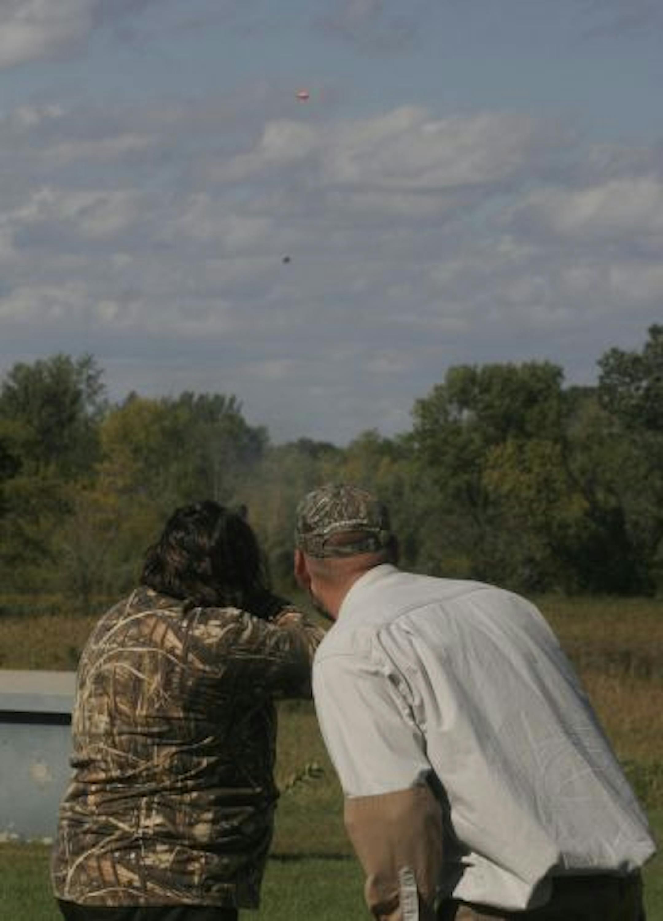 Scott Terning gave some shooting pointers to Jamie Gangaware at the Minneapolis Gun Club in Lakeville, where the woman shot targets and received tips before hunting.