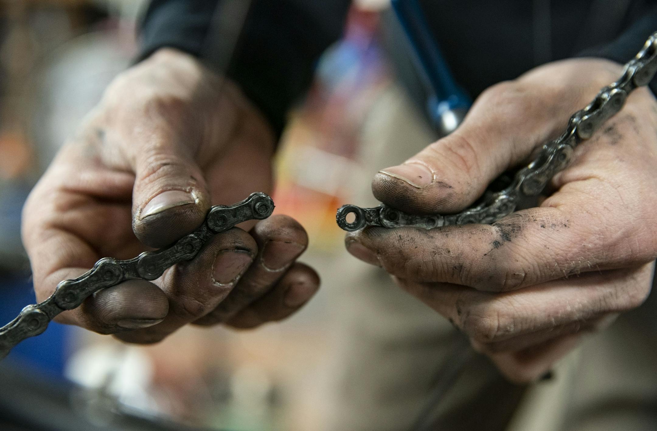 Cassidy Olson a mechanic at Twin Ports Cyclery separated a chain on a bike on Friday afternoon.