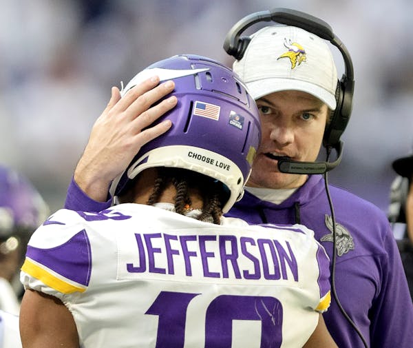 Minnesota Vikings head coach Kevin O'Connell hugs Justin Jefferson (18) after a fourth quarter touchdown Saturday, December 24, 2022, at U.S. Bank Sta