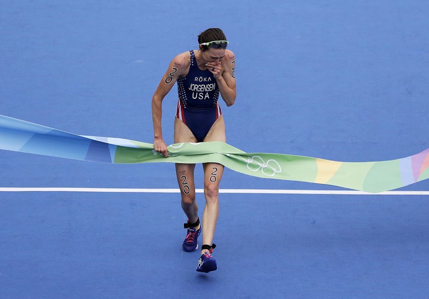 Gwen Jorgensen of St. Paul crosses the finish line to win the women's triathlon event at the 2016 Summer Olympics in Rio de Janeiro on Saturday.