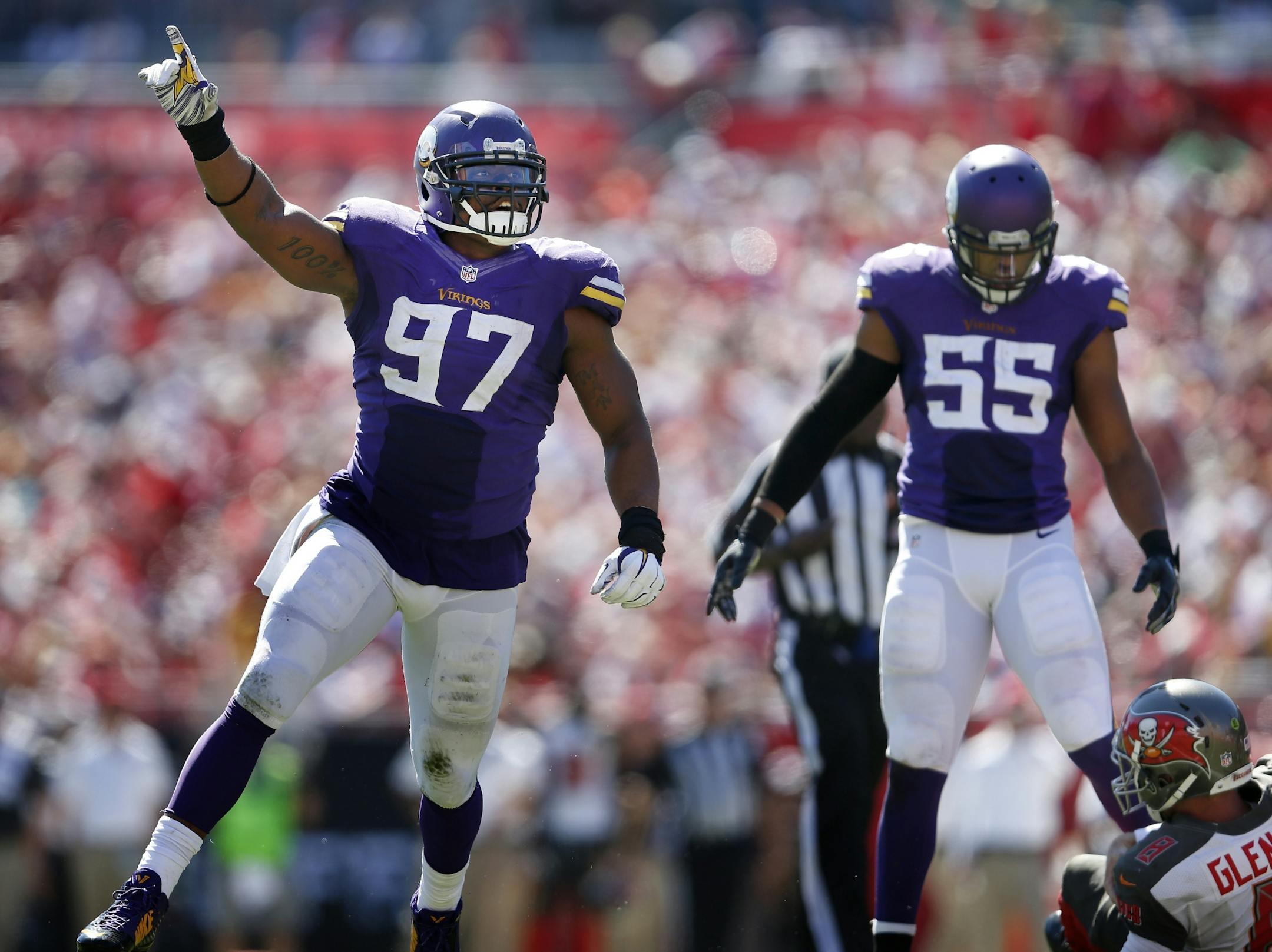 Everson Griffen (97) celebrated after he sacked Tampa Bay quarterback Mike Glennon (8) in the second quarter.