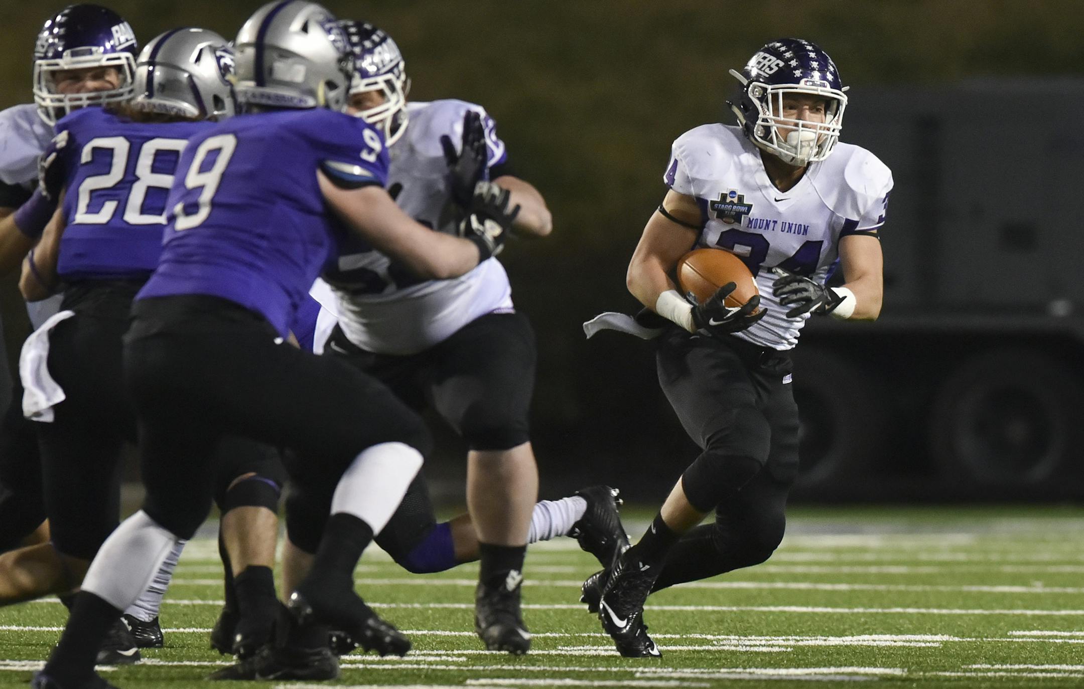 Mount Union running back Logan Nemeth (34) carries the ball against St. Thomas during the first half of the the NCAA Division III football championship game in Salem, Va., Friday, Dec. 18, 2015. (AP Photo/Michael Shroyer)