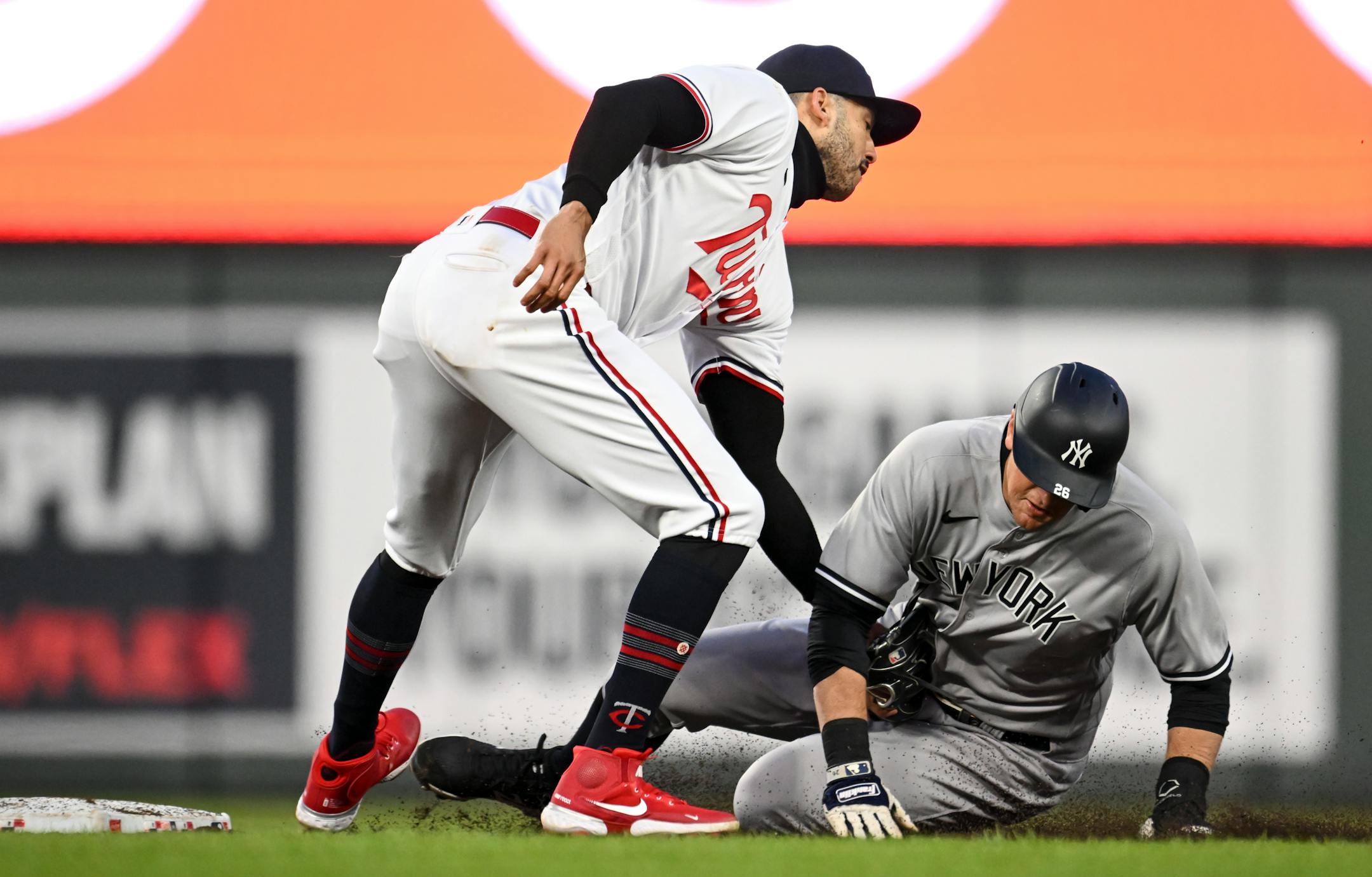 New York Yankees third baseman DJ LeMahieu (26) is out at second on a tag by shortstop Carlos Correa before Correa turned the double play to first base off a hit by left fielder Oswaldo Cabrera in the top of the fifth inning Monday.