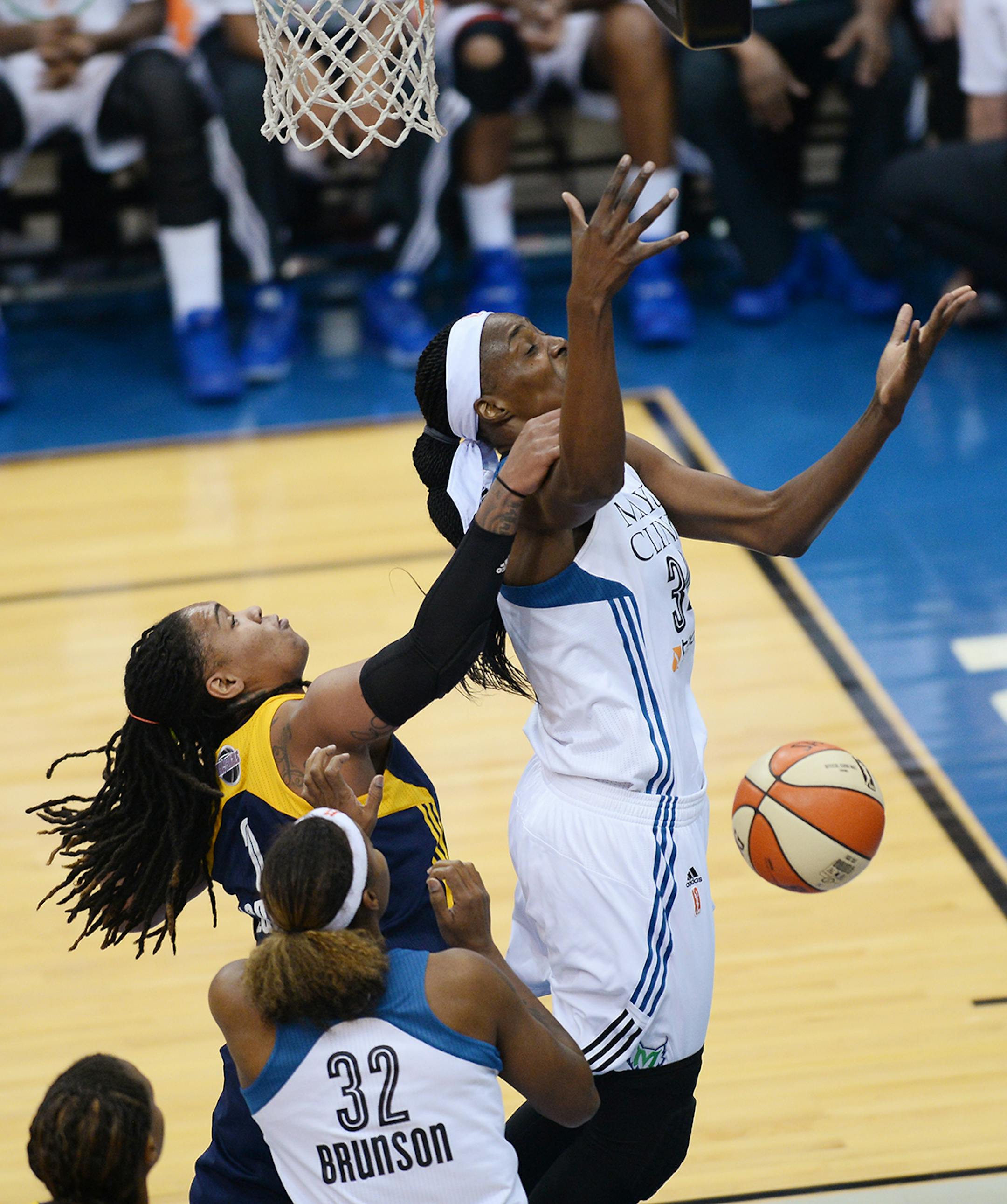 Minnesota Lynx center Sylvia Fowles (34) is fouled by Indiana Fever forward Erlana Larkins (2) during the first half.