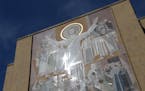 A mosaic mural nicknamed “Touchdown Jesus” is on the facade of the Hesburgh Library at Notre Dame in South Bend, Ind.