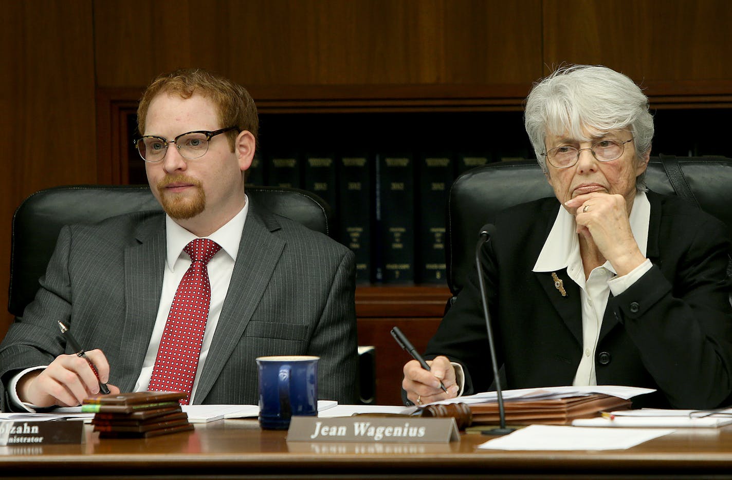 Mike Molzahn, left, and Rep. Jean Wagenius, the Chair of the Environment, Natural Resources, and Agriculture Finance Committee, listened to Jess Richards, the Director of the Division of Lands and Minerals, Tuesday, February 11, 2014 at the State Office Building in St. Paul, MN. (ELIZABETH FLORES/STAR TRIBUNE) ELIZABETH FLORES &#xa5; eflores@startribune.com