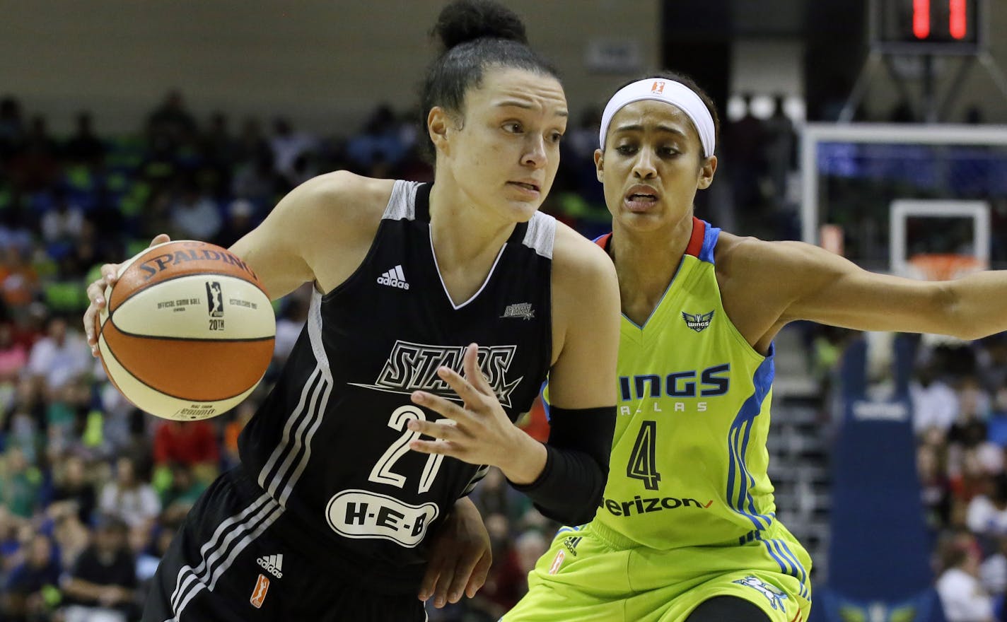 San Antonio Stars guard Kayla McBride (21) drives against Dallas Wings guard Skylar Diggins (4) during a 2016 game.