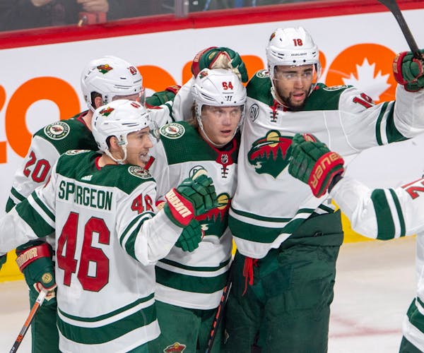 Wild right winger Mikael Granlund (64) celebrated the game's lone goal against the Canadiens, surrounded by teammates Jared Spurgeon (46), Ryan Suter 