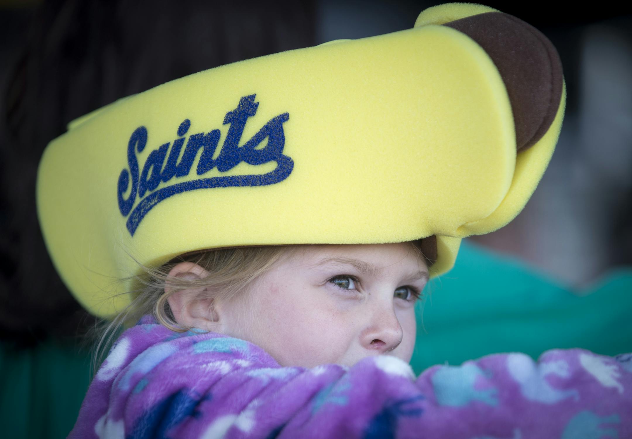Alana Hartmann, 6, wore at Saints hotdog hat before Thursday night's game while eating popcorn. ] Aaron Lavinsky &#x2022; aaron.lavinsky@startribune.com The St. Paul Saints hold their season opener against the Fargo-Moorhead Redhawks at brand-new CHS Field on Thursday, May 21, 2015.