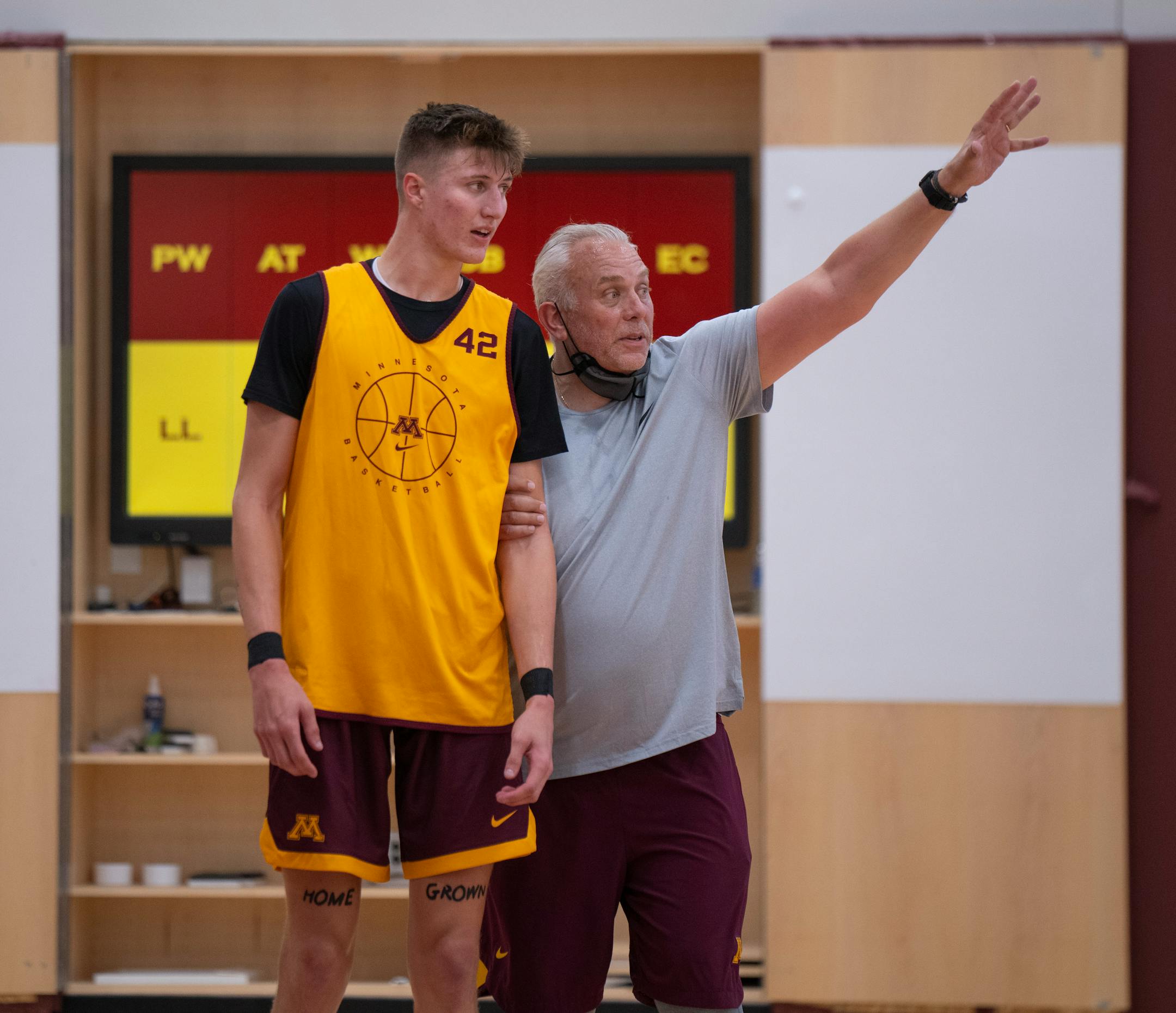 Assistant coach Dave Thorson instructed center Treyton Thompson what he wanted out of a drill on the first day of practice Tuesday afternoon.