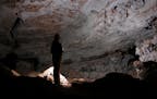A caver&#x2019;s flashlight probes the recesses of the Tabernacle Room at Wind Cave National Park in South Dakota.