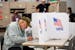 Voters cast early ballots for the midterm elections on Sept. 23 in Minneapolis. 