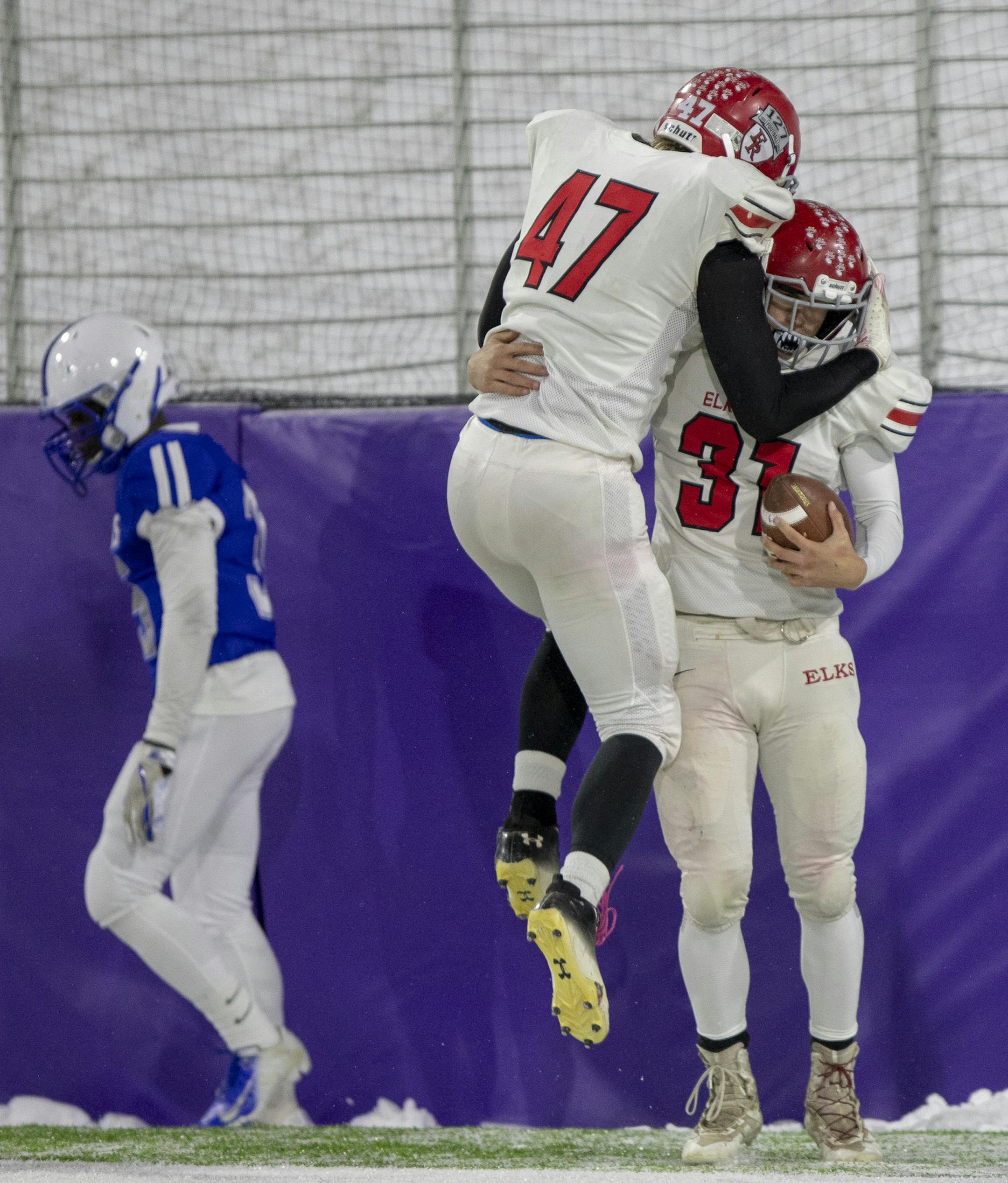 Corey Hughes of Elk River (47) congratulates Adam Nelson of Elk River (31) on scoring a touchdown. ] Special to Star Tribune, photo by Matt Blewett, Matte B Photography, matt@mattebphoto.com, High School Football, Class 6A, Elk River vs Spring Lake Park, 1007668759 - PREP111118 PREP.late