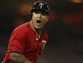 The Twins' Oswaldo Arcia shouted to his teammates in the dugout as he ran to first after hitting the walk off home run that give the Twins the win Mon