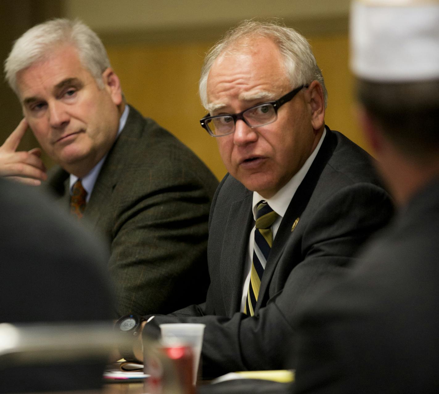 U.S. Reps. Tom Emmer (left) and Tim Walz discuss tensions between management and workers at the St. Cloud VA Medical Center after a meeting Friday. They spoke afterward during a veterans round table at the American Legion Post 621 in St. Augustus, Minn.