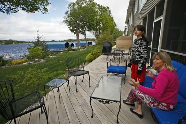 Daughter Anna Whitworth, left and mother Susan Tenney sat on the deck behind their townhome.