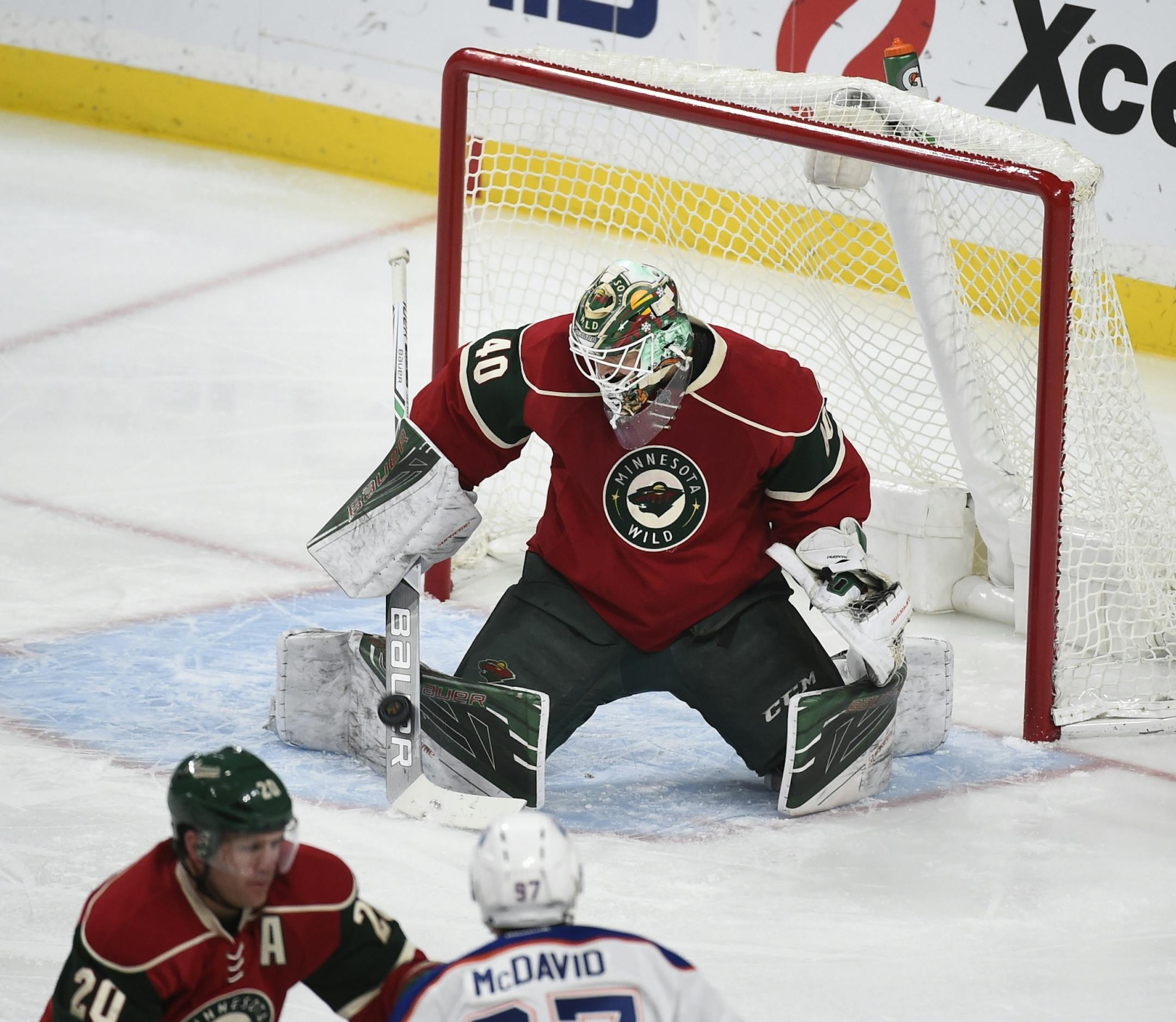 Minnesota Wild's goalie Devan Dubnyk (40) stops a shot by the Edmonton Oilers during the first period of an NHL hockey game, Friday, Dec. 9, 2016, in St. Paul, Minn.