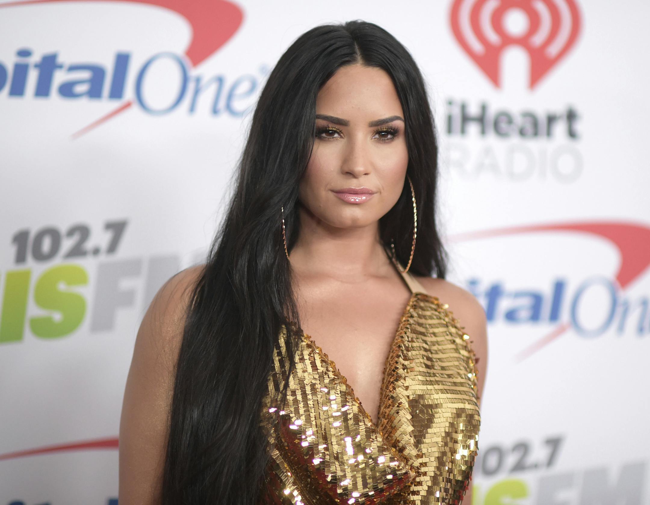 FILE - In this Dec. 1, 2017 file photo, Demi Lovato arrives at Jingle Ball at The Forum in Inglewood, Calif. Lovato celebrated six years sober at a concert in New York with tour mate and DJ Khaled, whose powerful brought the pop star to tears. Lovato performed Friday, March 16, 2018 at the Barclays Center in Brooklyn, New York, telling the audience March 15 was a proud day for her. (Photo by Richard Shotwell/Invision/AP, File)
