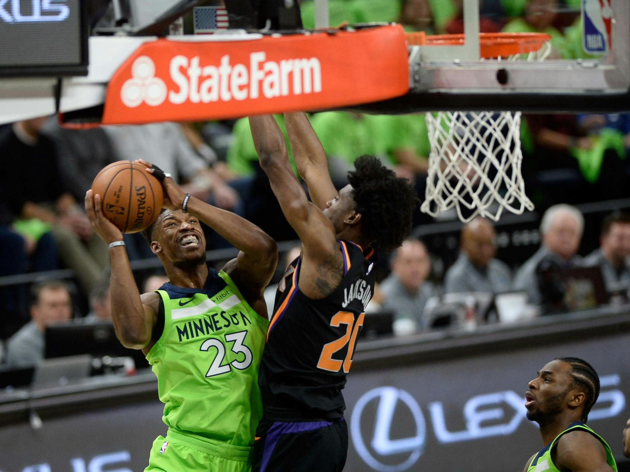 Minnesota Timberwolves guard Jimmy Butler (23) powered past the defense of Phoenix Suns forward Josh Jackson (20) for a layup in the first quarter. ] AARON LAVINSKY ï aaron.lavinsky@startribune.com The Minnesota Timberwolves played the Phoenix Suns on Saturday, Dec. 16, 2017 at Target Center in Minneapolis, Minn.