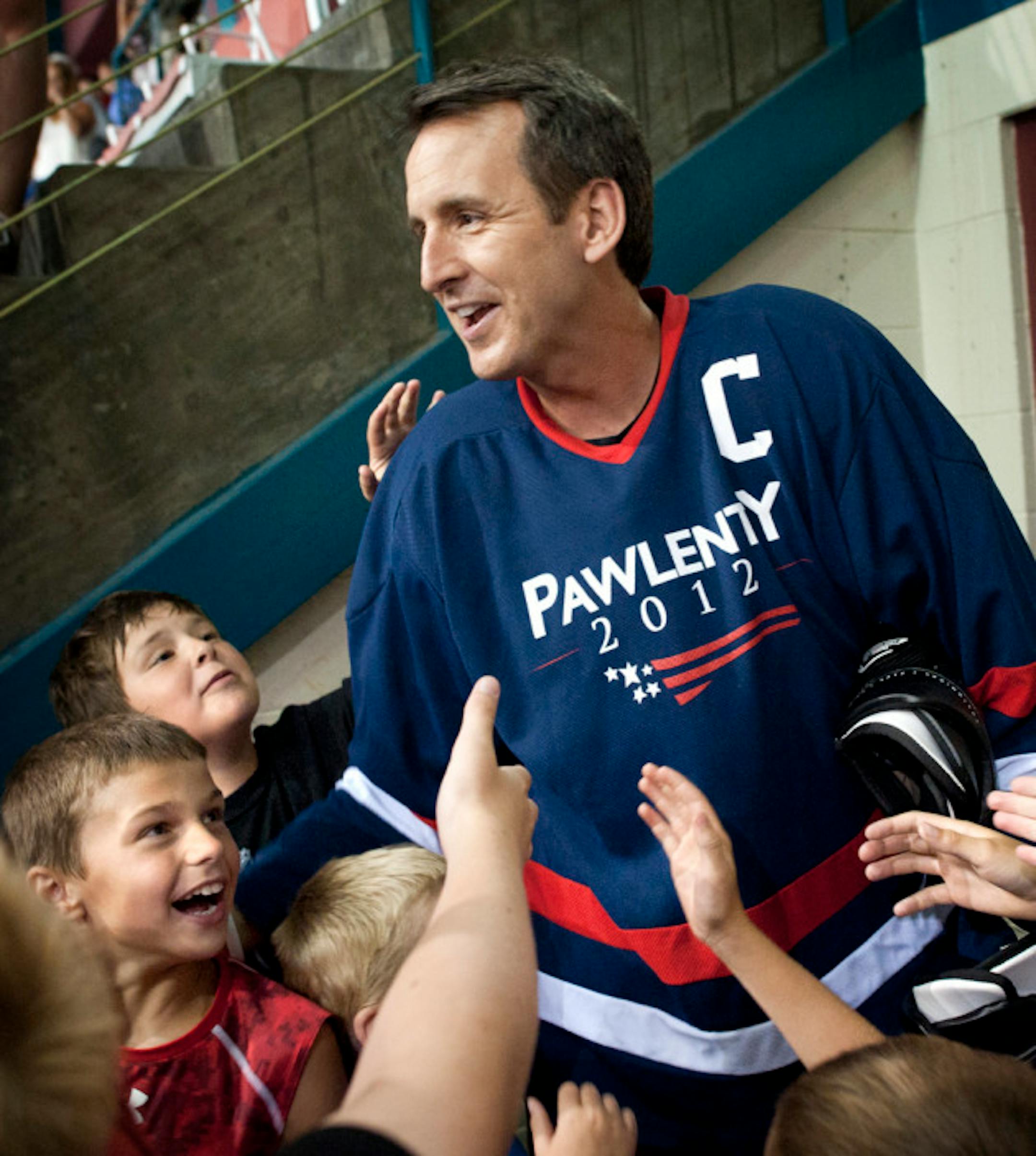 To chants of T-Paw, T-Paw from local kids, Tim Pawlenty took to the ice in Iowa for a game of hockey.   ]   GLEN STUBBE • gstubbe@startribune.com