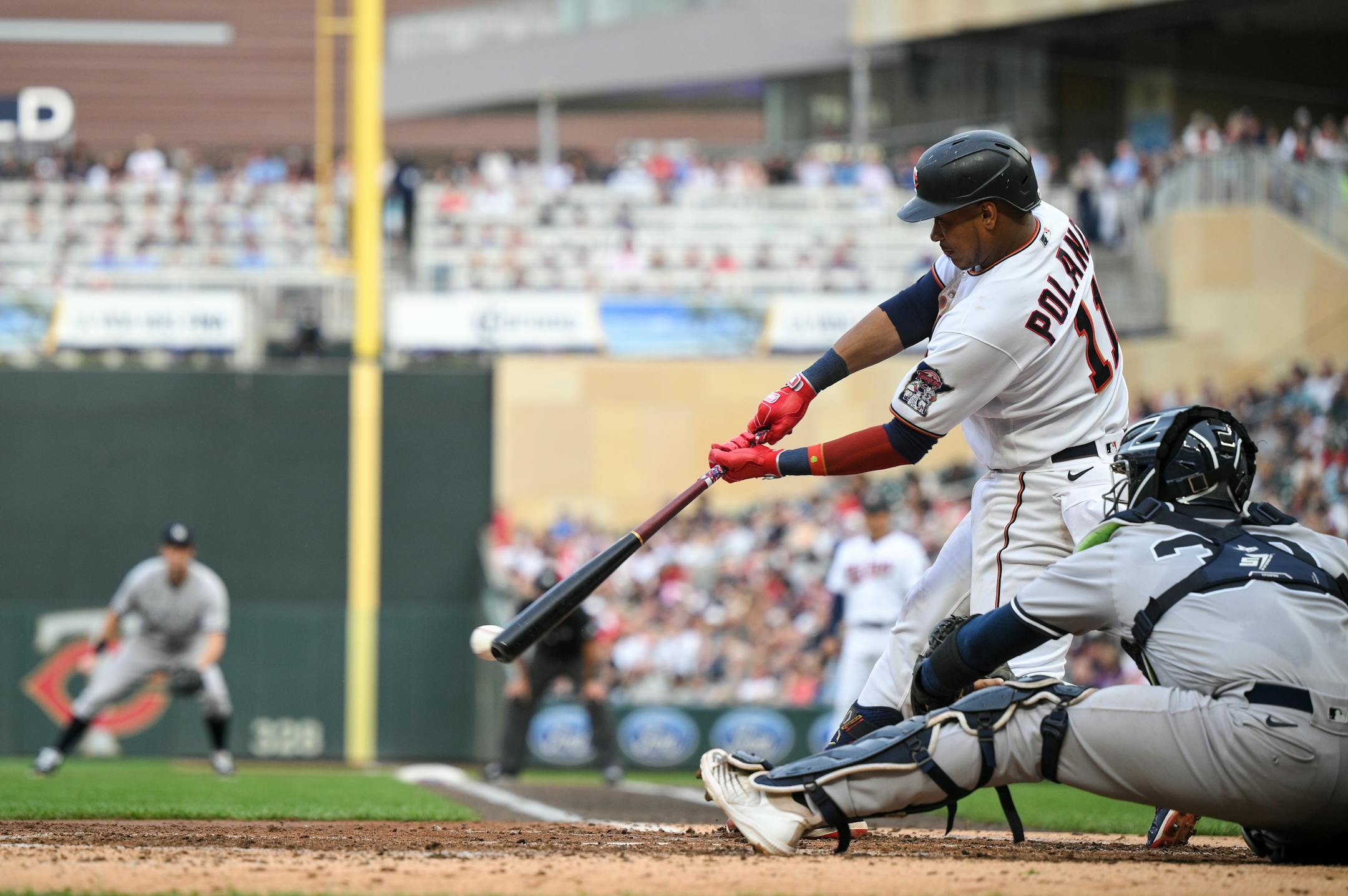 Minnesota Twins second baseman Jorge Polanco (11) hits a single in the bottom of the second inning against the New York Yankees.