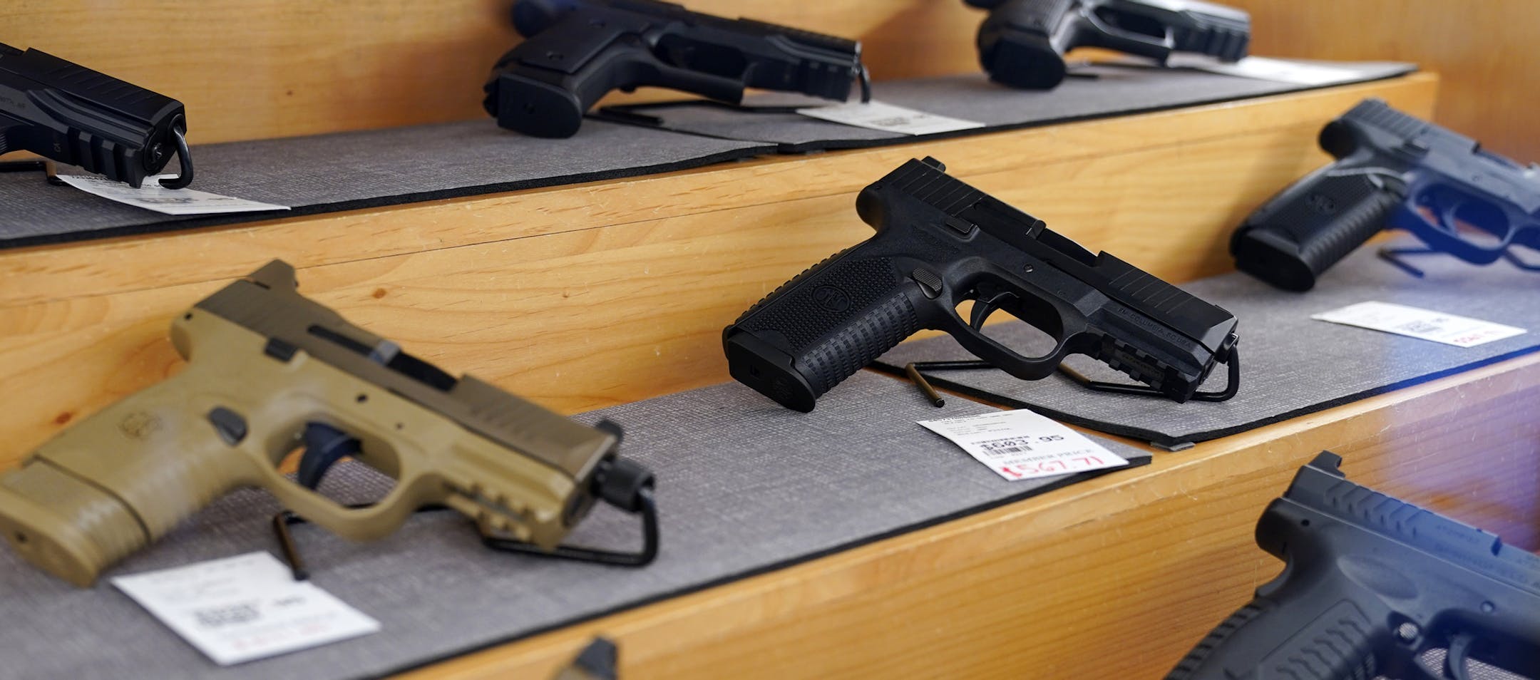 Handguns for sale sat behind glass in cases at the Stock & Barrel Gun Club Wednesday afternoon. ] ANTHONY SOUFFLE • anthony.souffle@startribune.com Customers fired guns on the shooting rage at the Stock & Barrel Gun Club Wednesday, Sept. 2, 2020 in Chanhassen, Minn. Customers are buying up guns and ammunition in droves, motivated by the COVID-19 pandemic and the riots following the George Floyd killing, leaving a significant shortage of both items. Factories that make guns and bullets aren't ope