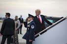 President Donald Trump boards Air Force One at Palm Beach International Airport in West Palm Beach, Fla., Jan. 1, 2018. Trump&#xed;s linkage of the an