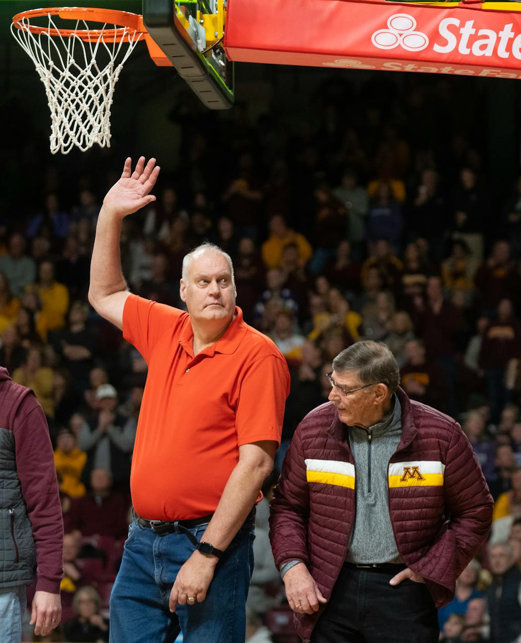 Minnesota basketball legend Randy Breuer gestures to the crowd while being recognized at halftime on alumni day Saturday.