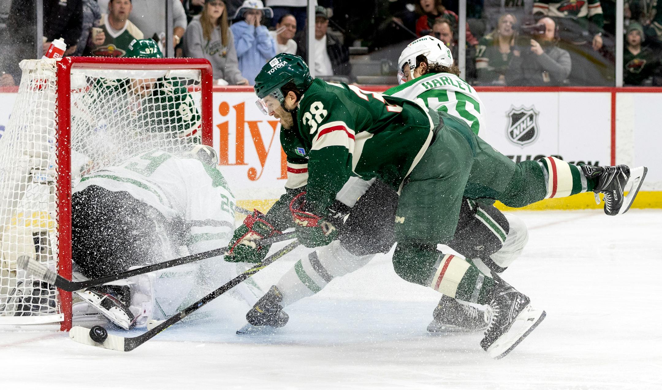Ryan Hartman (38) of the Minnesota Wild attempts a shot in the second period.