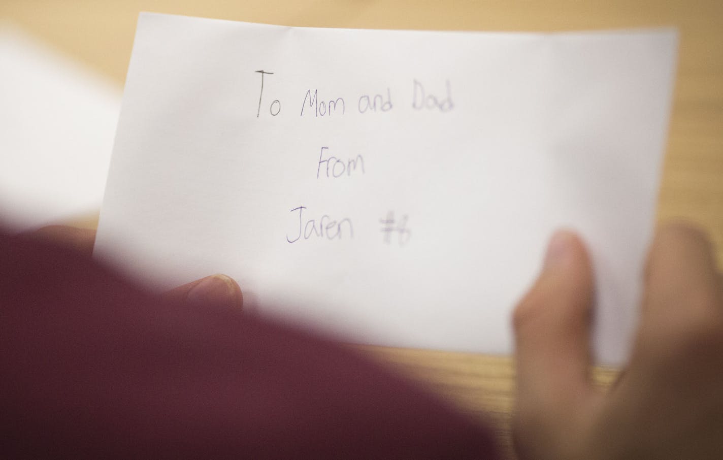 A student addressed a letter of appreciation to his parents during football practice at Atwater-Cosmos-Grove High School in Grove City, Minn., on Monday October 5, 2015. ] RENEE JONES SCHNEIDER &#x2022; reneejones@startribune.com The coach of the Atwater-Cosmos-Grove City football team in central MN is focusing on more than Xs and Os. He's taking his team through some unusual non-athletic exercises to help them become respectful, responsible men, especially to women.