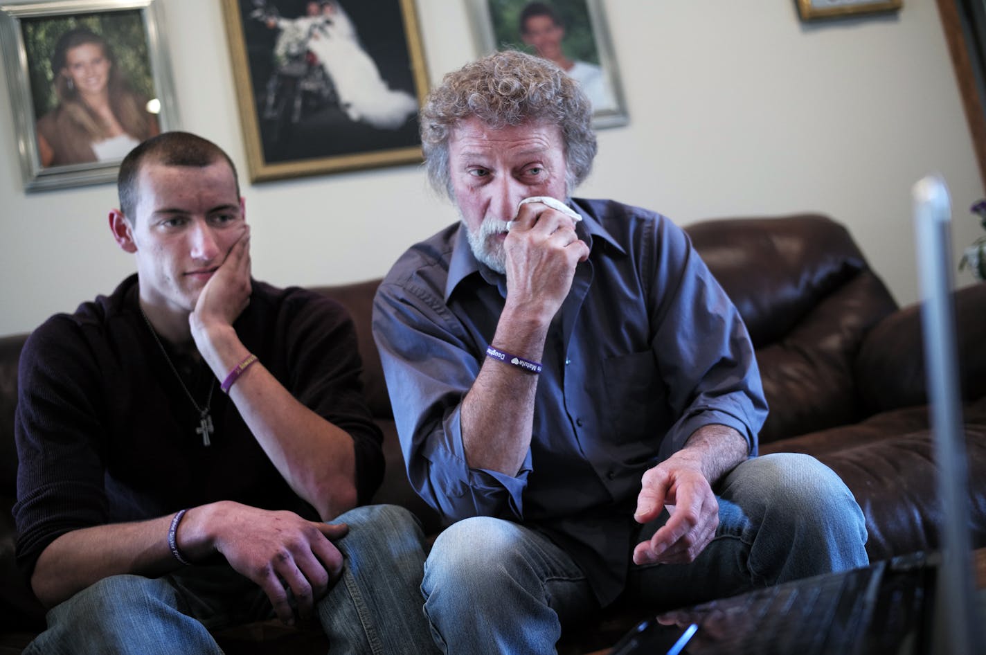 At the home of Wayne Matula, father and son Steven, looked over a memorial video of Mandy Matula who disappeared about a year ago. Wayne still looks at photos and video daily from the memorial service to keep the memory of his daughter alive. ]richard.tsong-taatarii/rtsong-taatarii@startribune.com