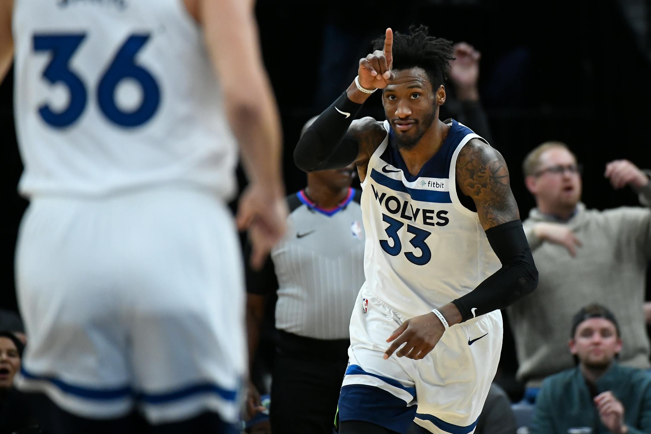 Timberwolves forward Robert Covington (33) reacts after scoring a basket against the Hornets