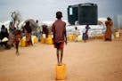 Outside the Dadaab refugee camp in eastern Kenya, a Somali boy waited to collect water. Kenya has threatened to close the camp, the world&#x2019;s lar