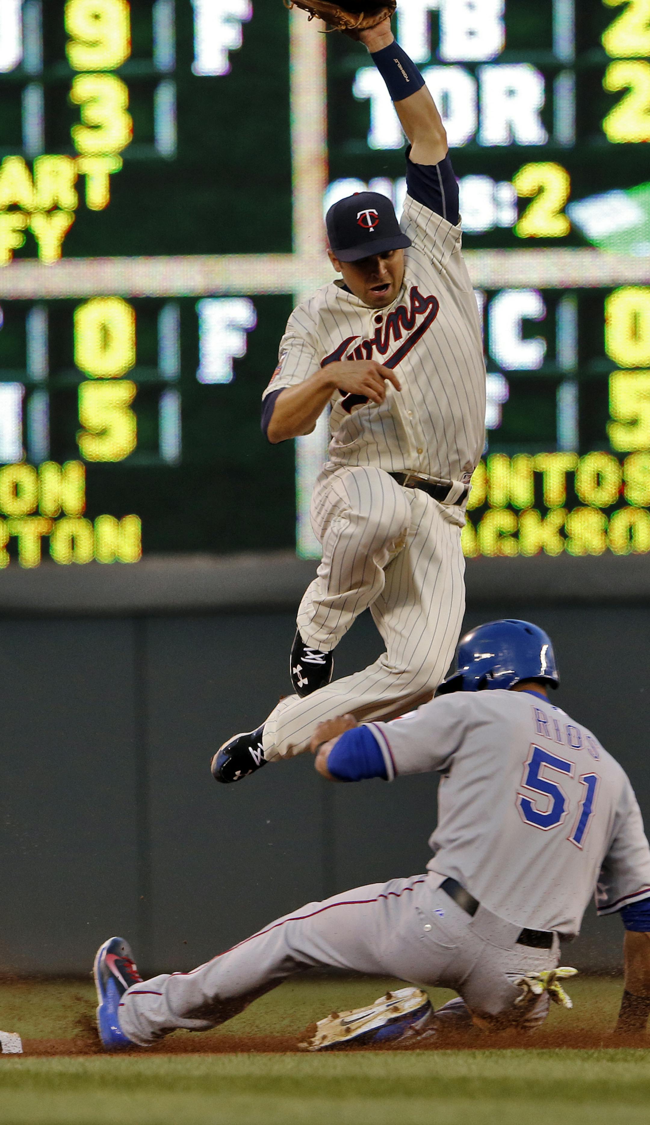 Texas baserunner Alex Rios was safe at 2nd on a stolen base as the ball sailed over the head of Twins second baseman Brian Dozier in 4th inning action. ] Minnesota Twins vs. Texas Rangers. . (MARLIN LEVISON/STARTRIBUNE(mlevison@startribune.com)