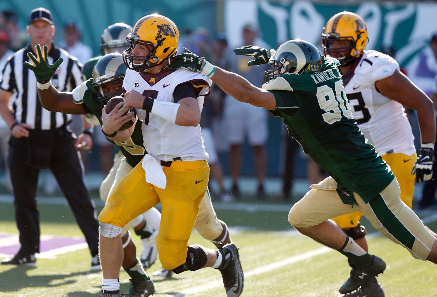 Gophers quarterback Mitch Leidner, center, ran for a short gain between Colorado State defensive linemen Martavius Foster, left, and Joe Kawulok on Saturday.