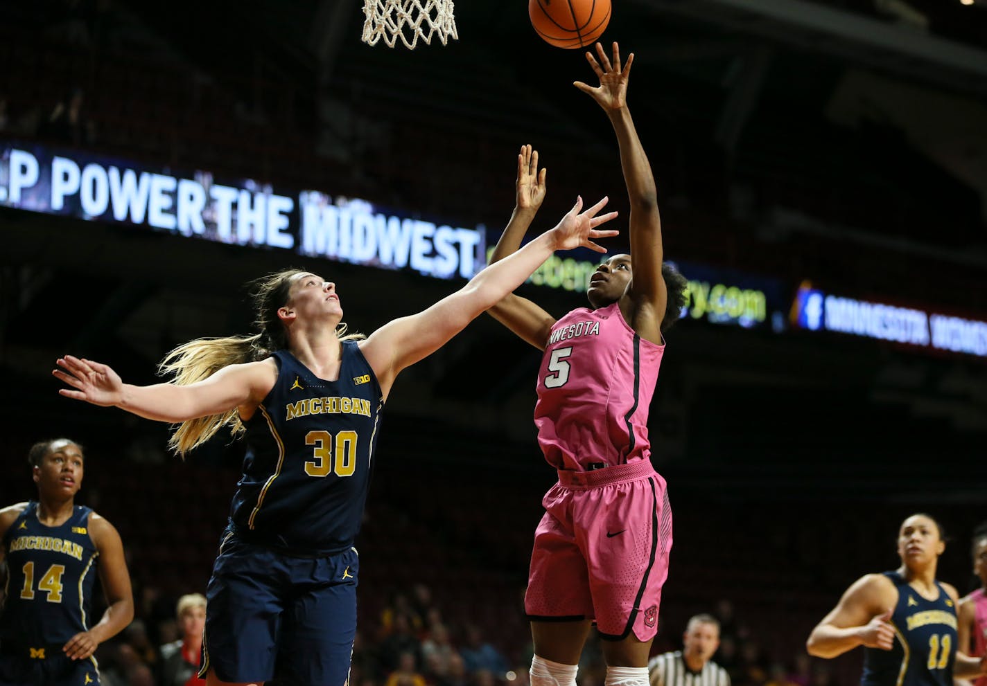 Gophers forward Taiye Bello (5, shown against Michigan earlier this month) had 10 points and 16 rebounds — 12 on the offensive end — in just 20 minutes of playing time in Sunday's 84-75 victory over Illinois.