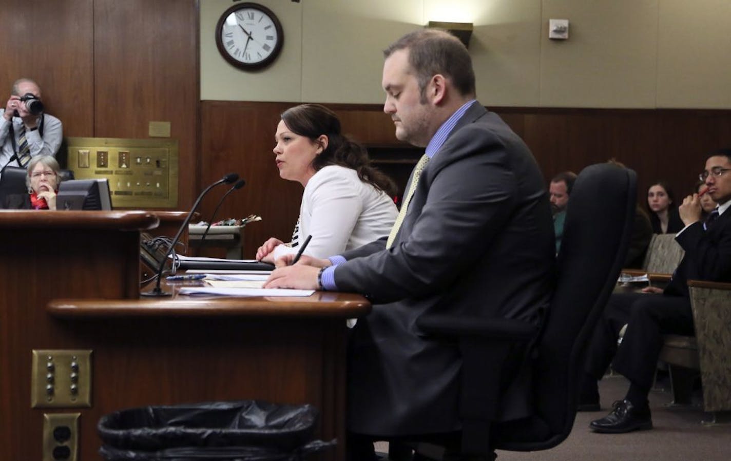 Bree Adams, Domestic Violence advocate for Saint Paul Intervention, spoke before the committee Tuesday, March 25, 2014, at the State Office in St. Paul, MN. Seated next to her is Rep. Dan Schoen (DFL), author of the bill.