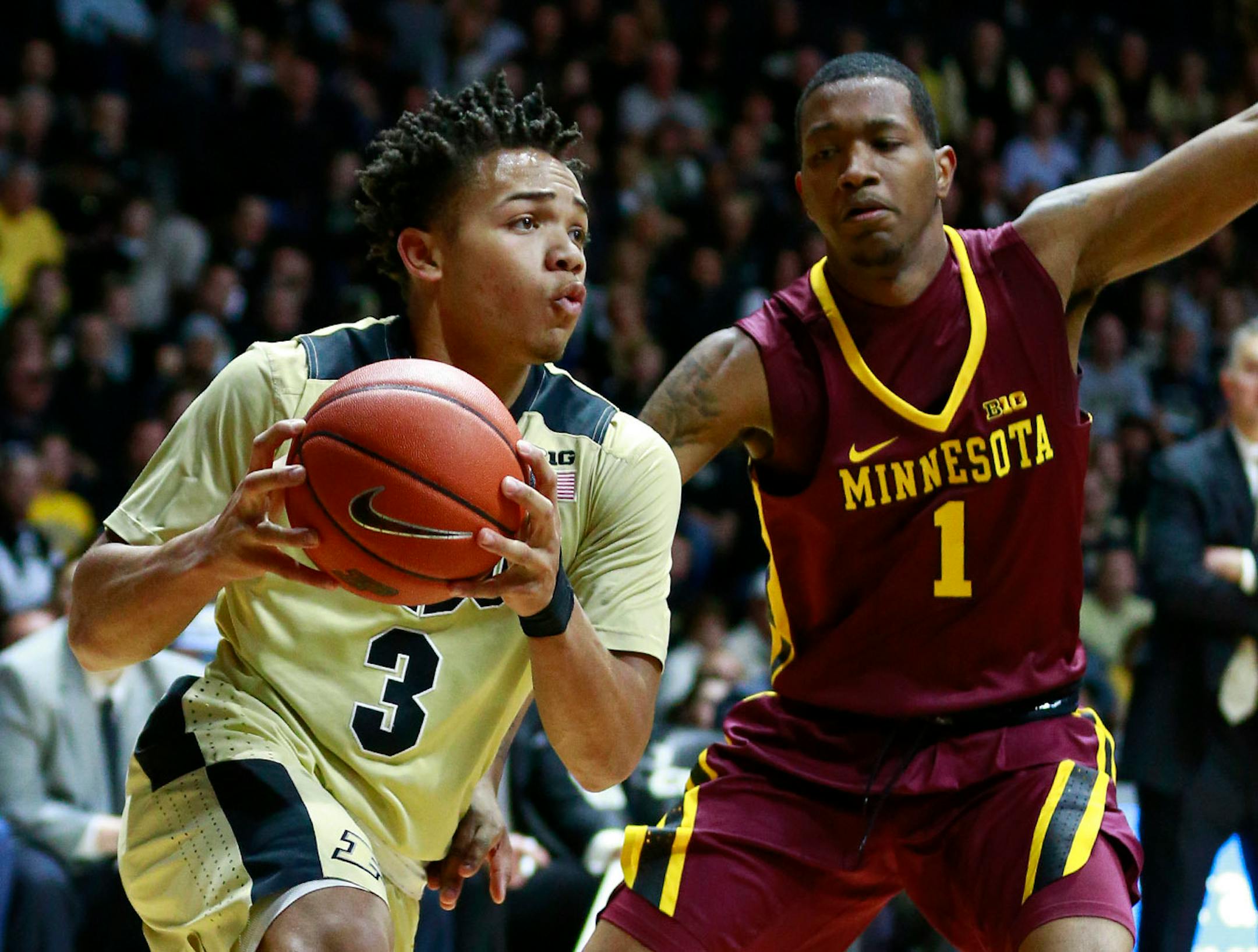 Purdue guard Carsen Edwards (3) drives past Minnesota guard DuPree McBreyer (1) during the second half of an NCAA college basketball game, Sunday, Jan. 1, 2017, in West Lafayette, Ind. Minnesota won 91-82.