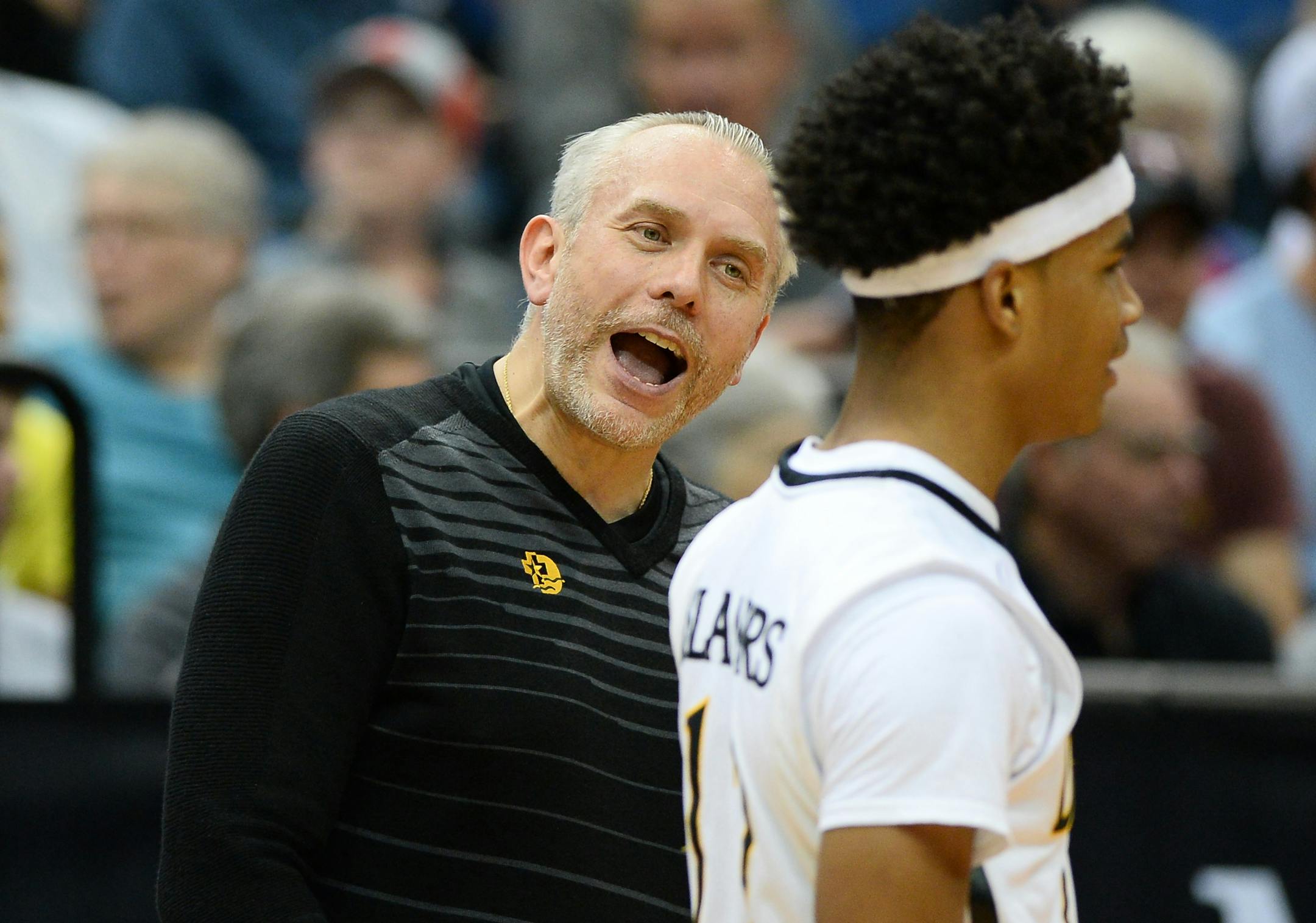 DeLaSalle boys' basketball coach Dave Thorson talked with guard Gabe Kalscheur during a break in the action during the Class 3A title game Saturday.
